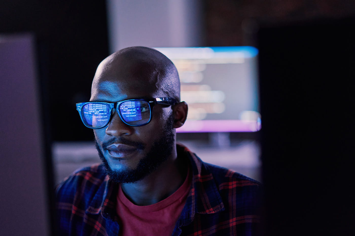 Tech professional working on code.