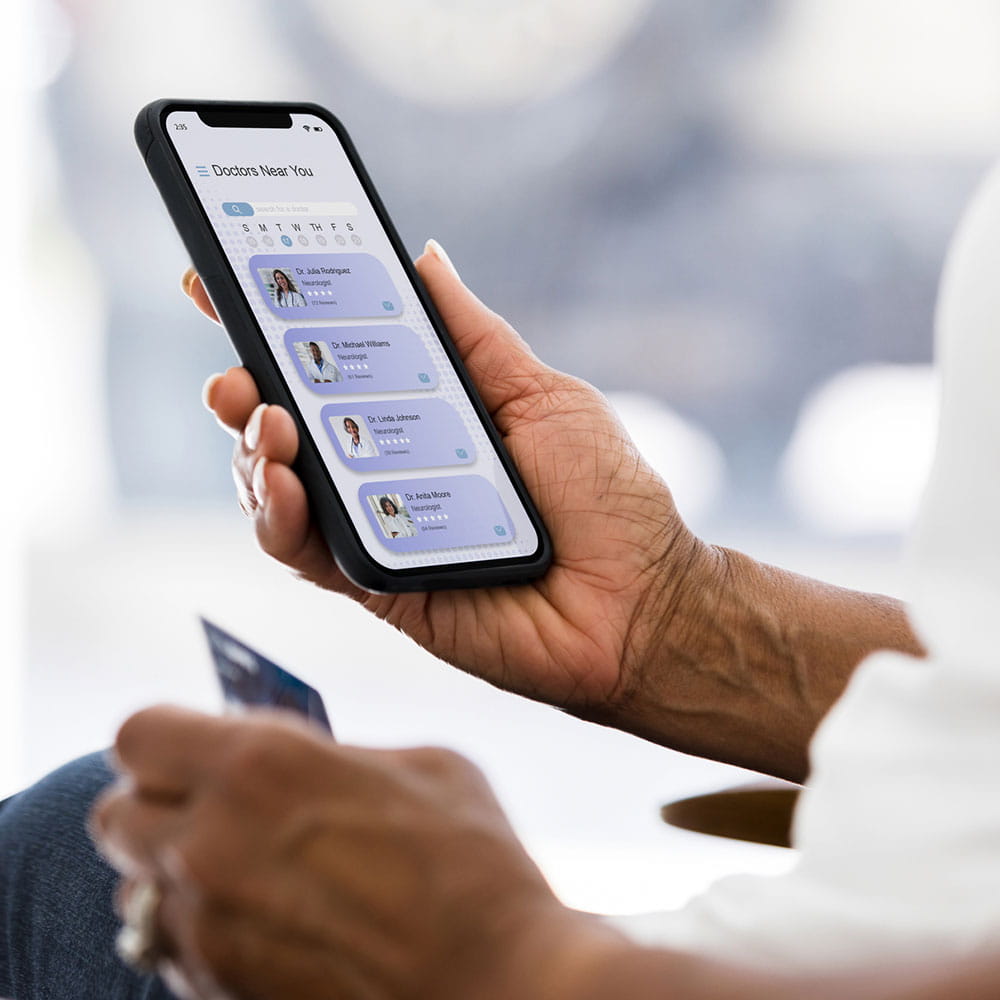 A person using their smartphone to find a doctor.