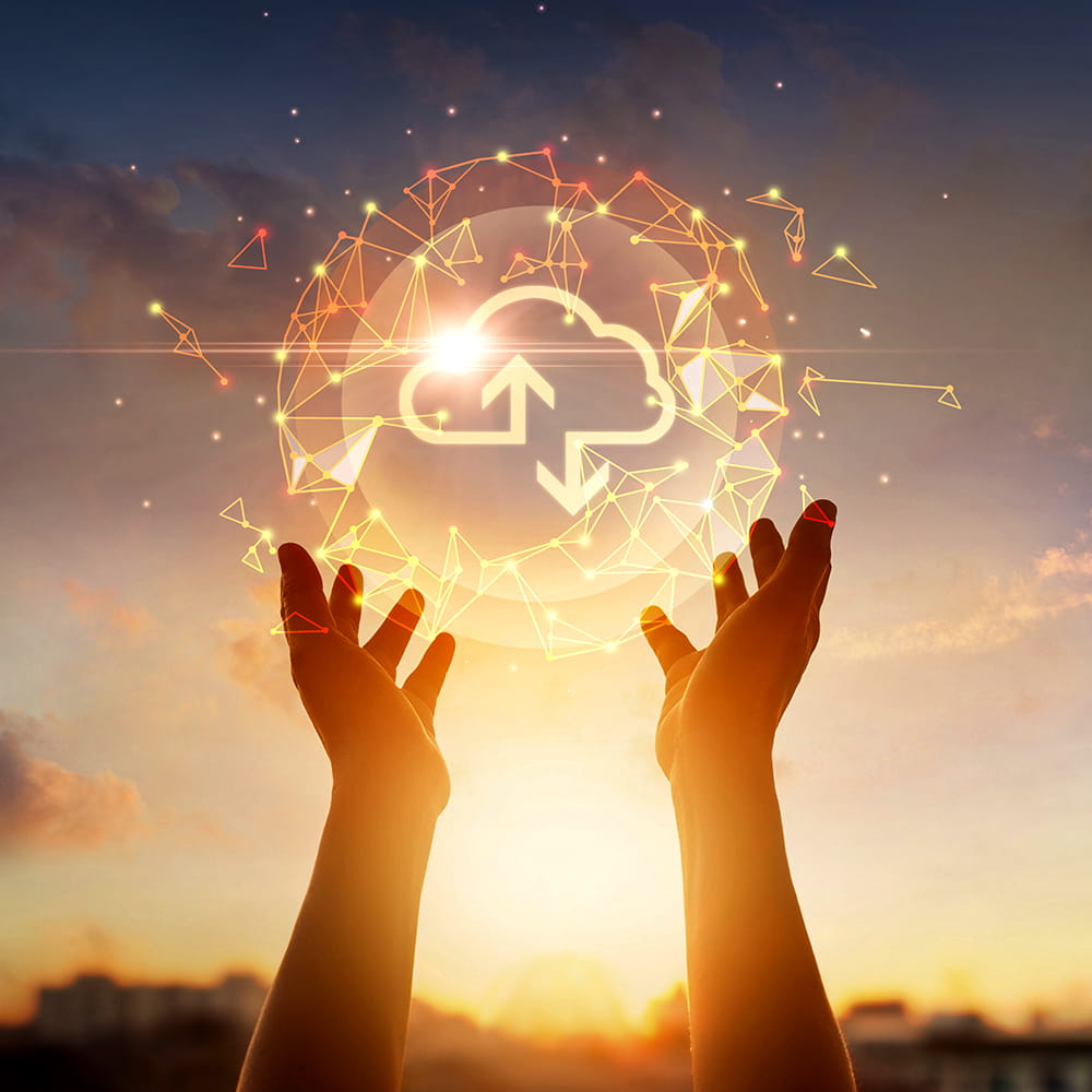 Hands holding a glowing orb with a cloud download symbol