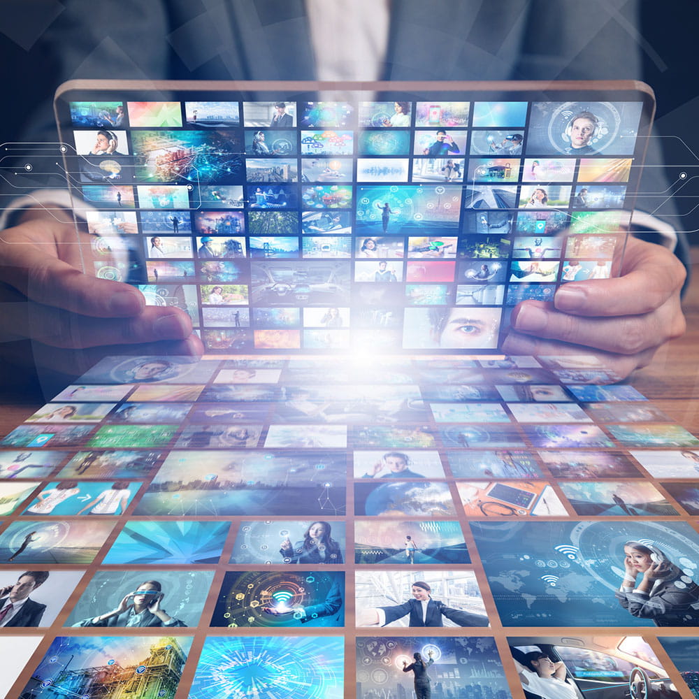 A tablet being held that has multiple screens opened on it. 