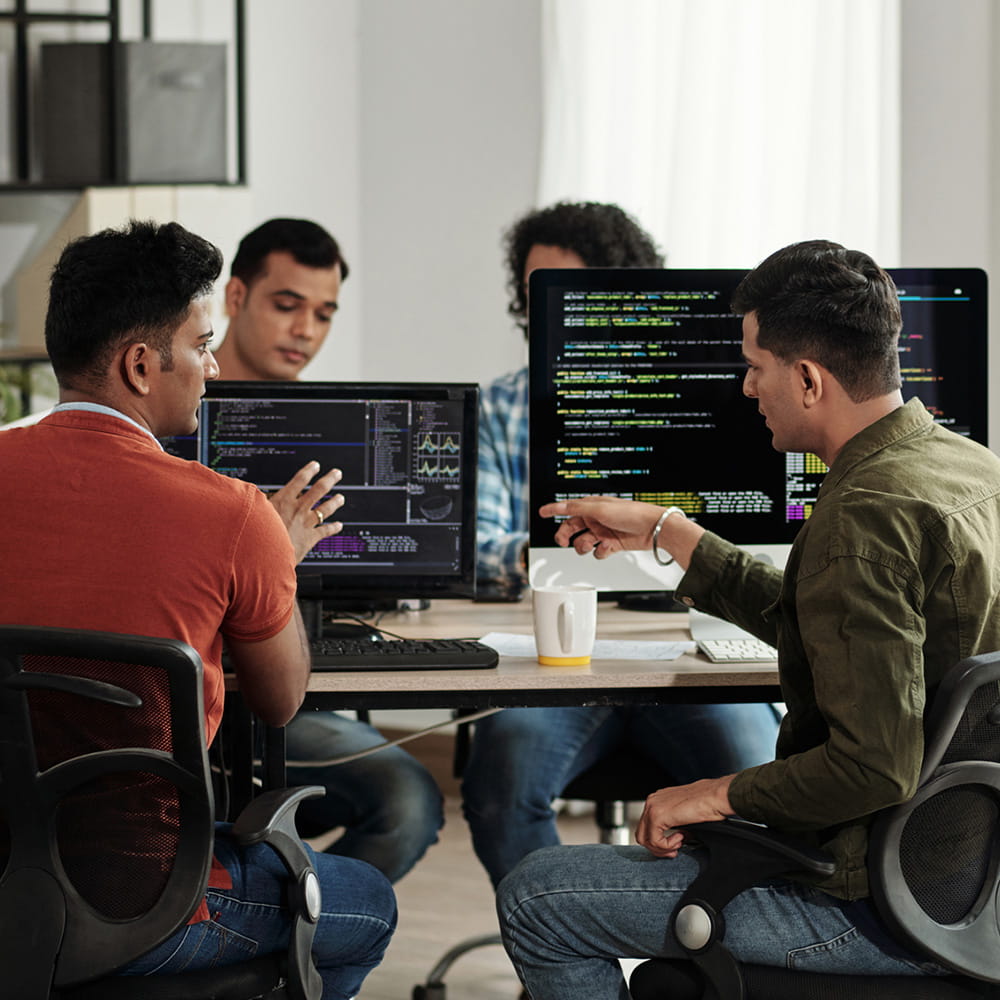 A group of web developers collaborating.