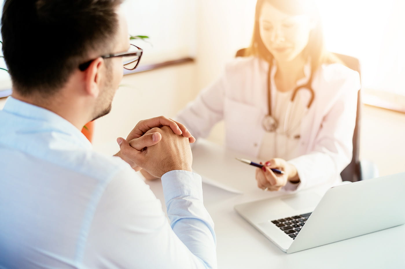 A doctor and patient talking.