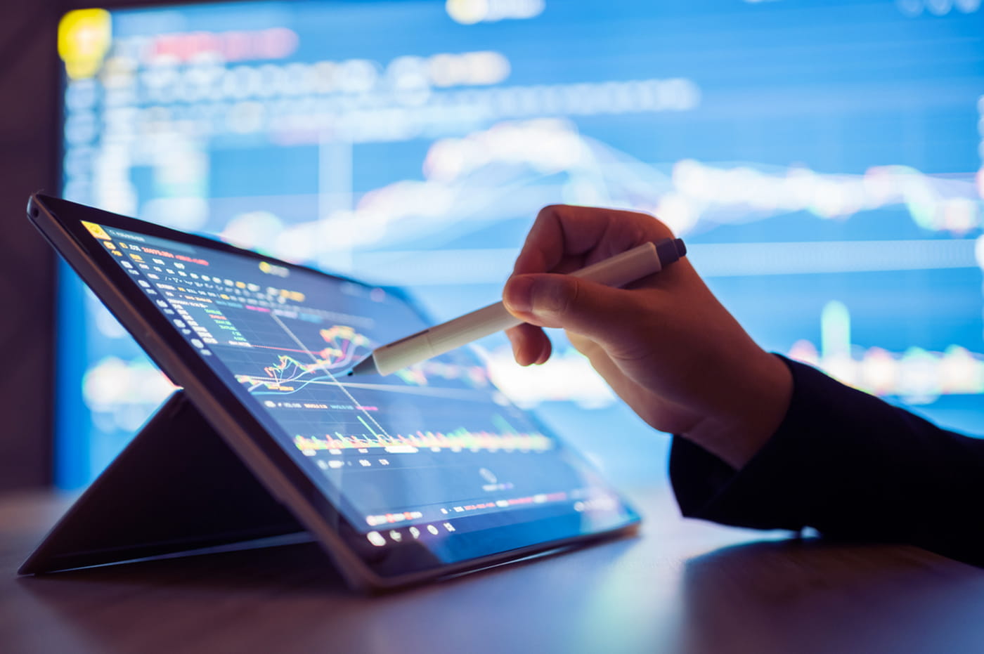 Person writing on a Tablet