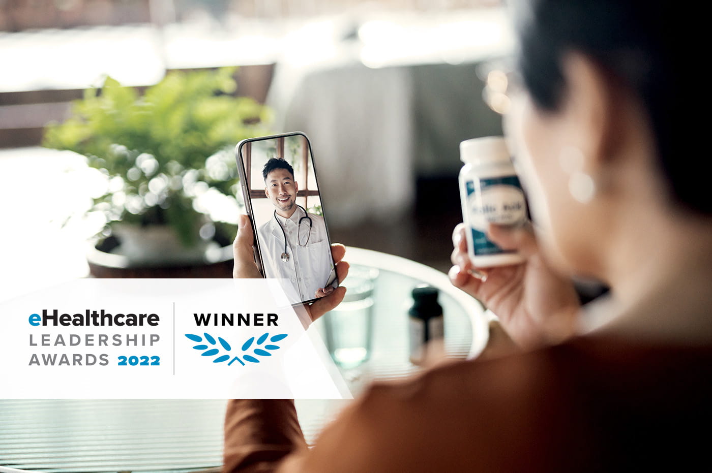 Woman using mobile phone to do a telehealth appointment with her doctor.