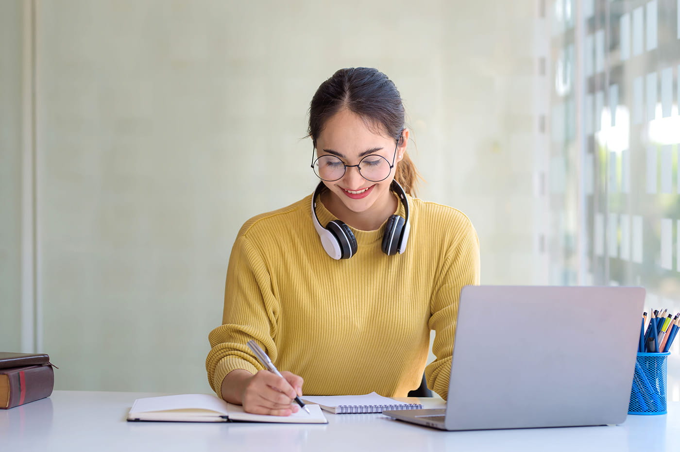 Woman at desk with a laptop