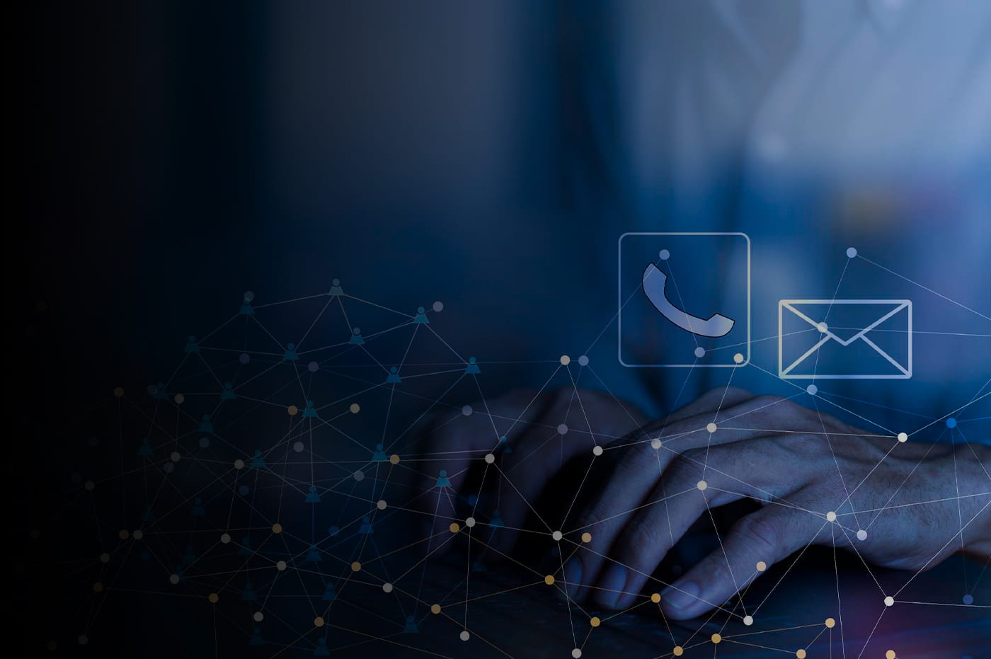 A phone and email icon above hands on a keyboard