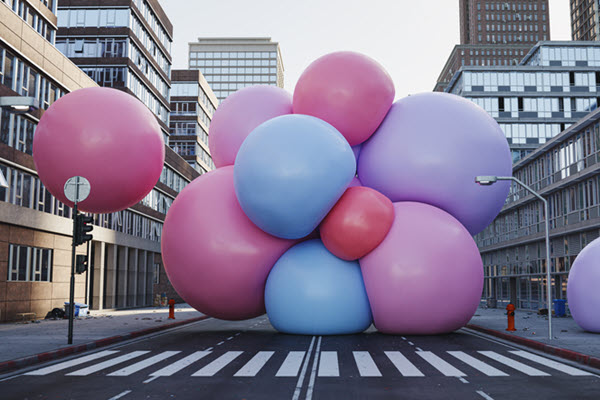 Conceptual blockers, large bouncy balls blocking a street.