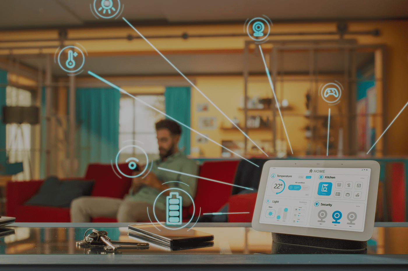 Man sitting on a couch with a tablet on a desk that has floating symbols around it 